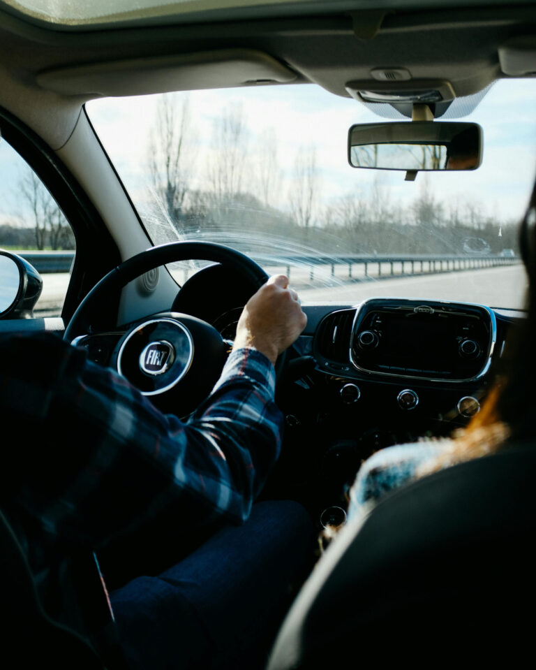 Two people sharing a car on their way to work